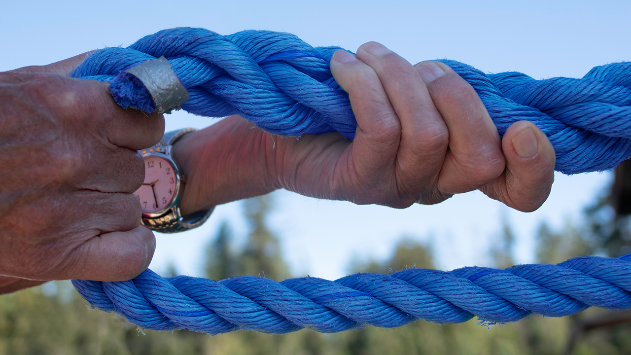 A person holding Paducah Rigging AmSteel-Blue Rope