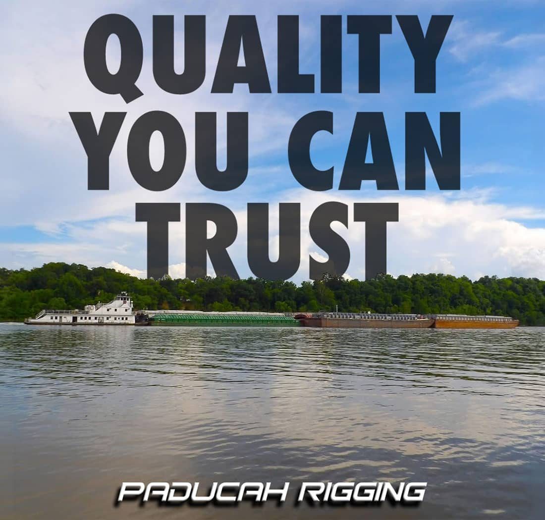 boat pulling cargo in the river